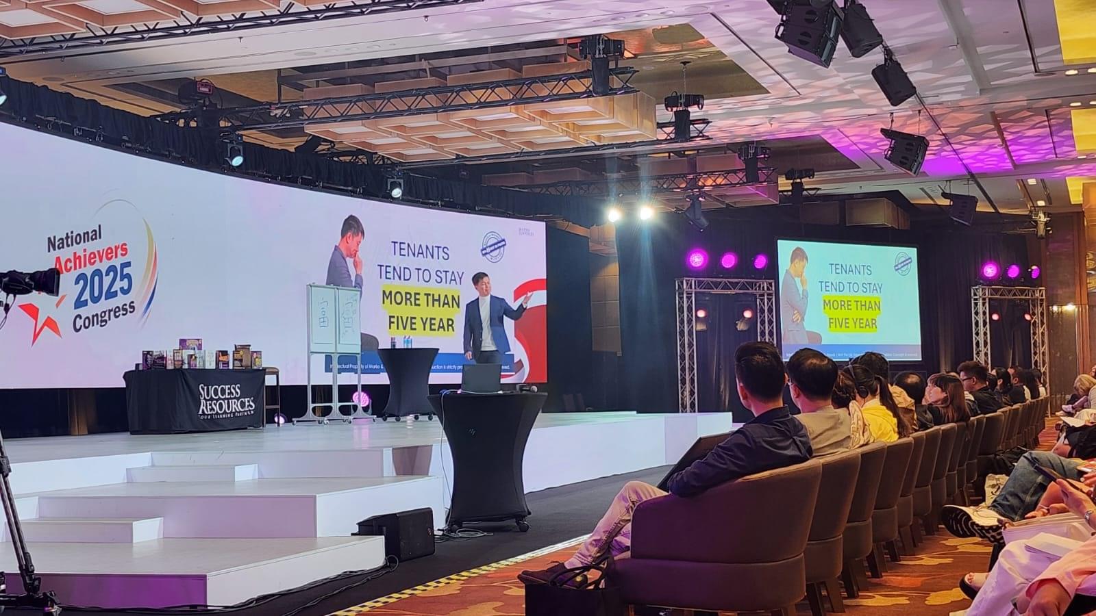 Marko on stage at the National Achievers Congress 2025